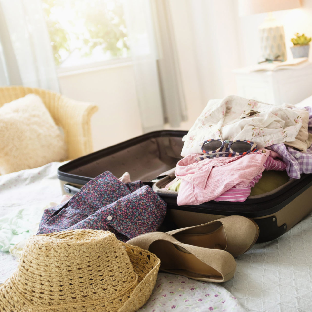 How to Fit Clothing in a Suitcase — How to Travel With Only a CarryOn